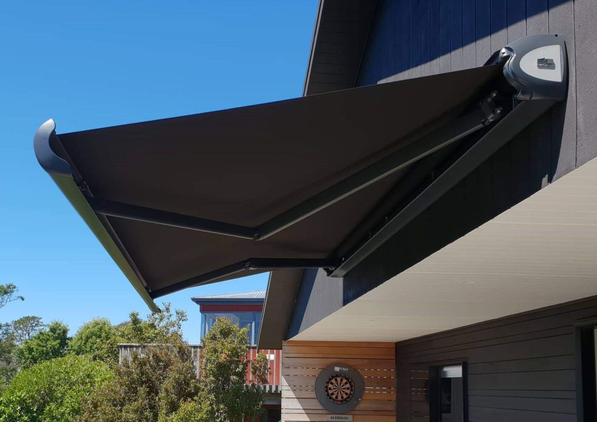 Dark Fetuna cassette awning over an outdoor living area