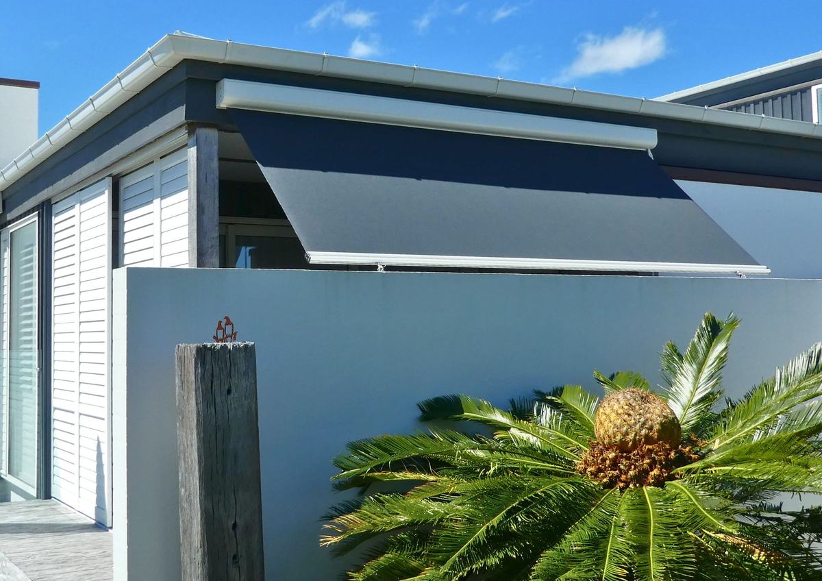 Omni outdoor blind partially lowered over a balcony opening