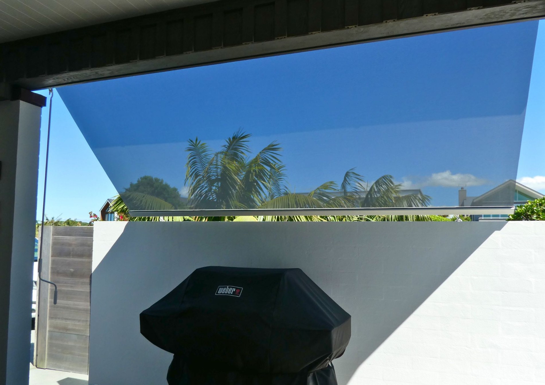Dark mesh Omni screen across an outdoor opening