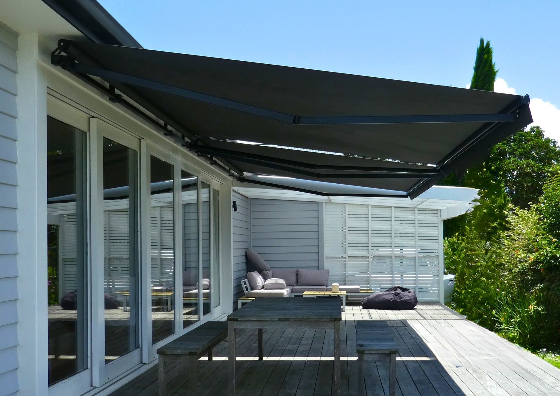 Ellipse retractable awning over outdoor area